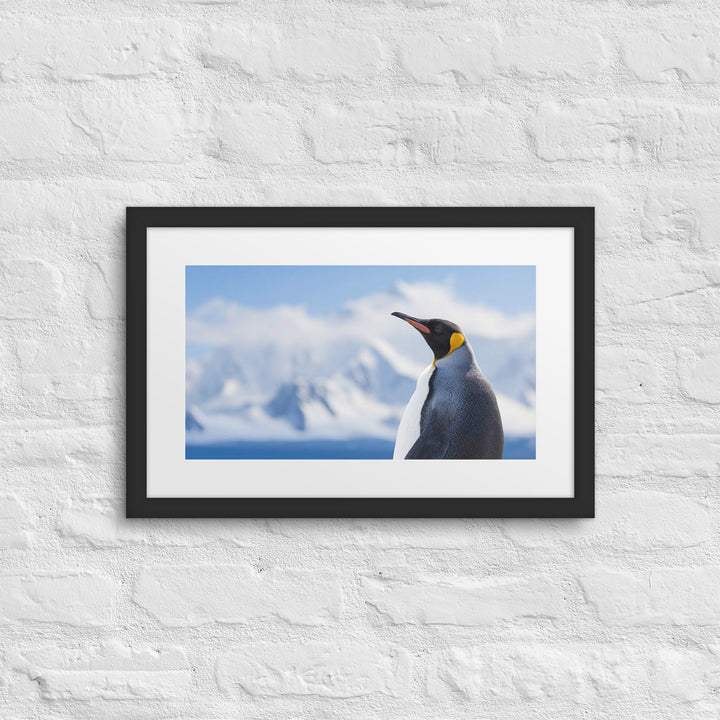 Majestic Solitude of a Penguin Amidst Snowy Peaks - Framed poster