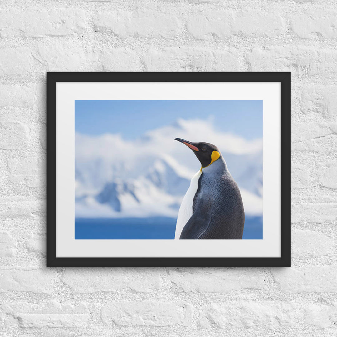 Majestic Solitude of a Penguin Amidst Snowy Peaks - Framed poster