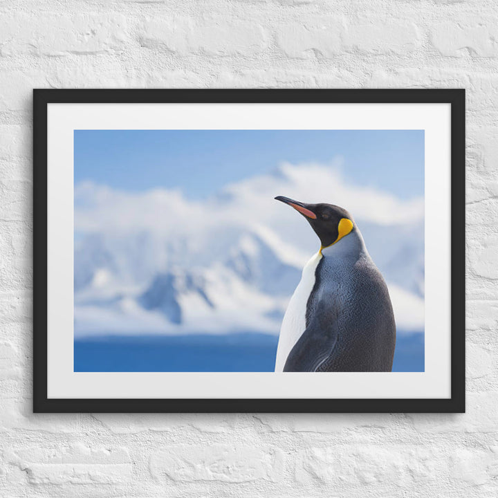 Majestic Solitude of a Penguin Amidst Snowy Peaks - Framed poster